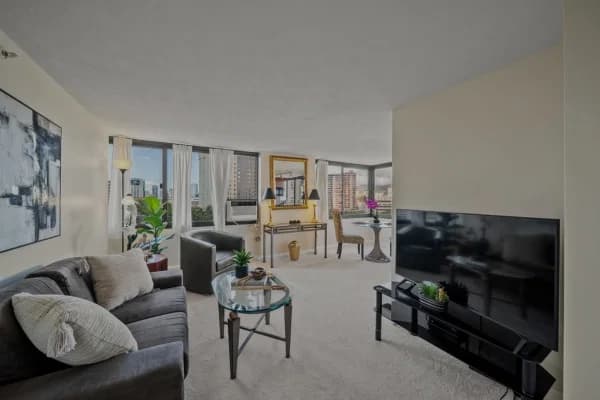 Bright living area with city views at 343 Hobron Lane #1001 in Waikīkī.