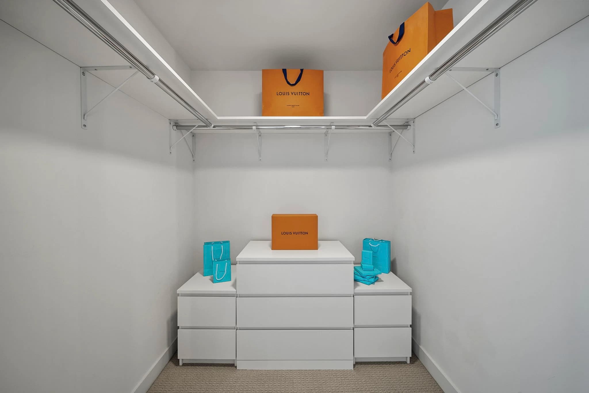 Walk-in closet with built-in storage drawers