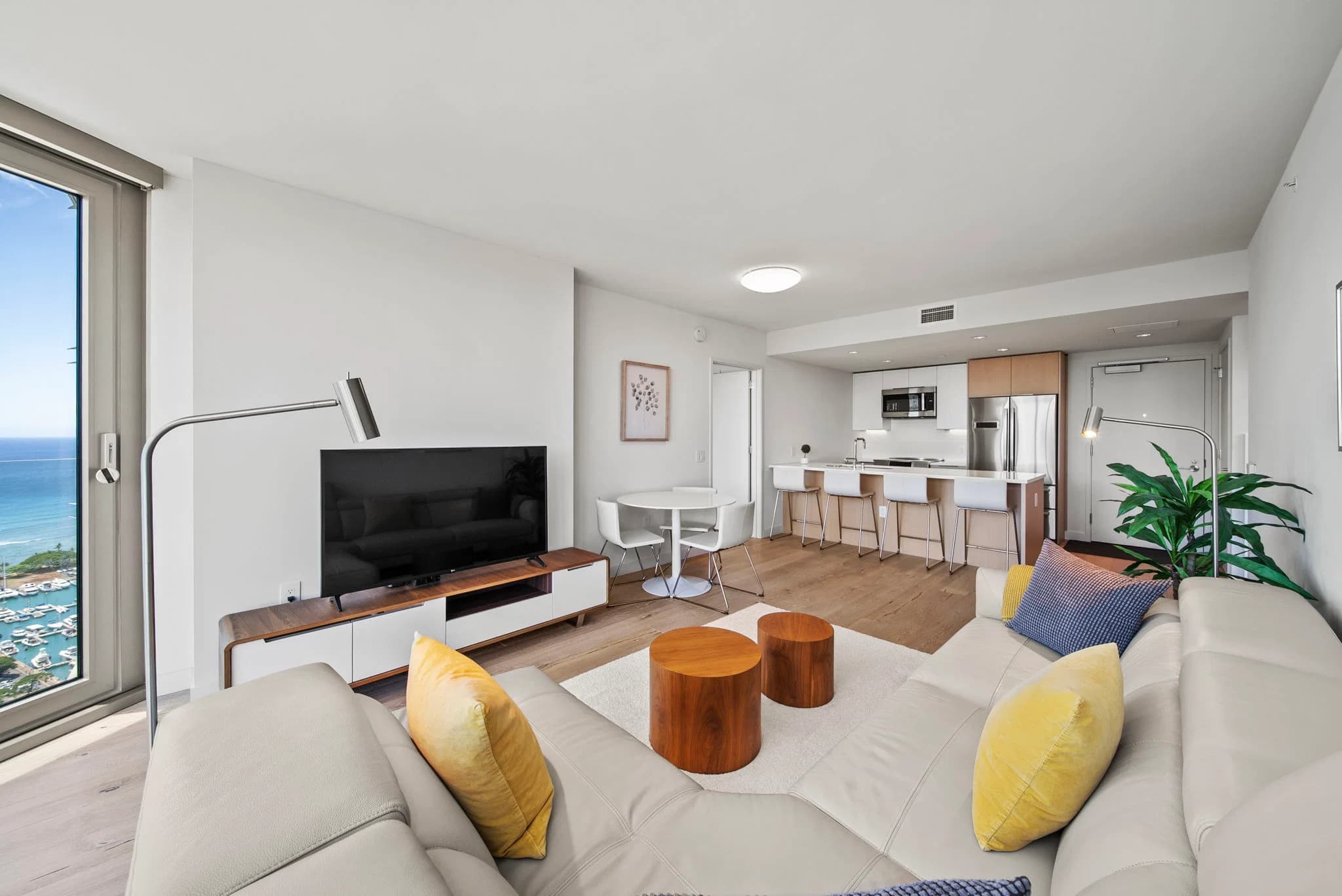 Bright living room overlooking Honolulu skyline