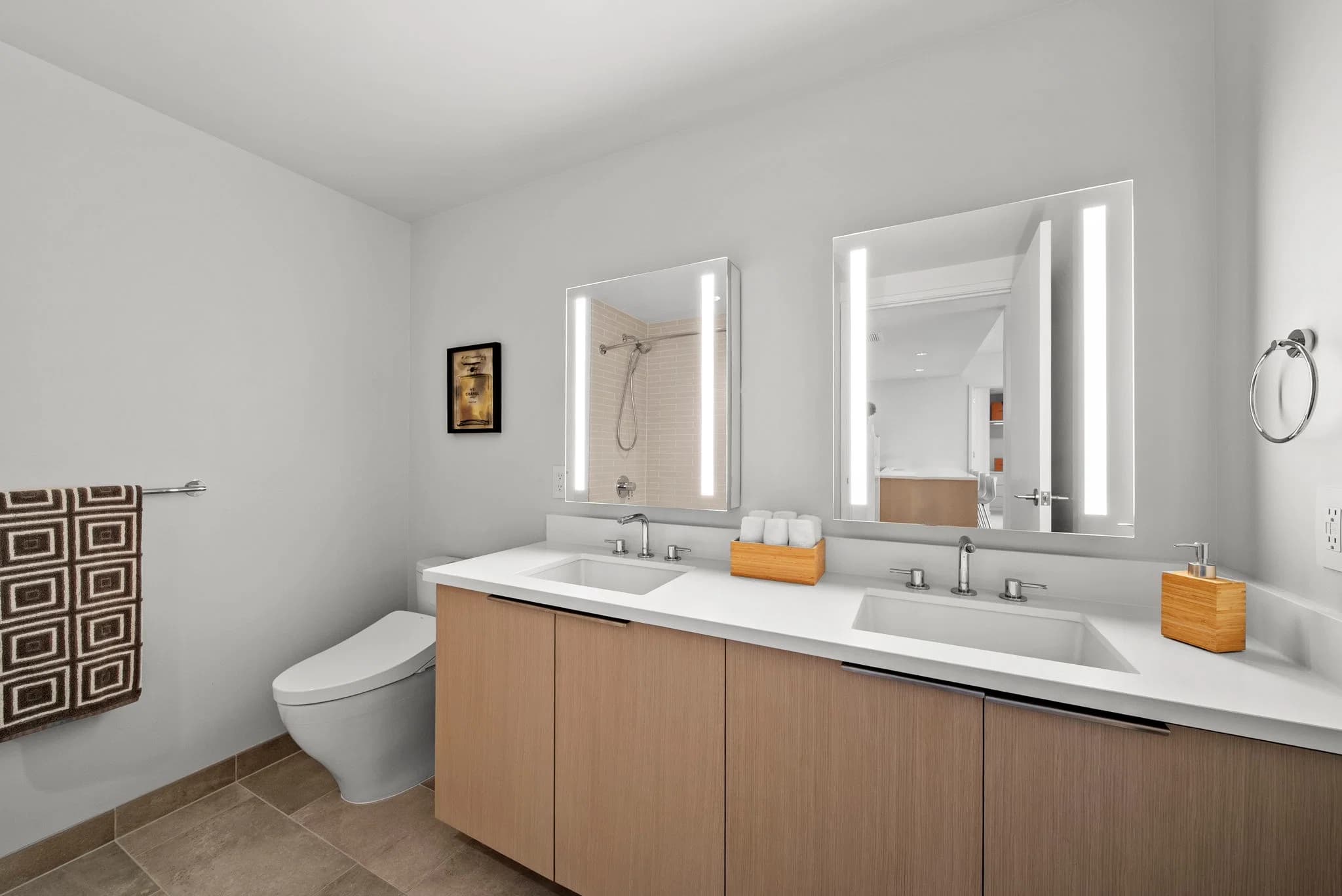Spacious bathroom with dual sinks and storage